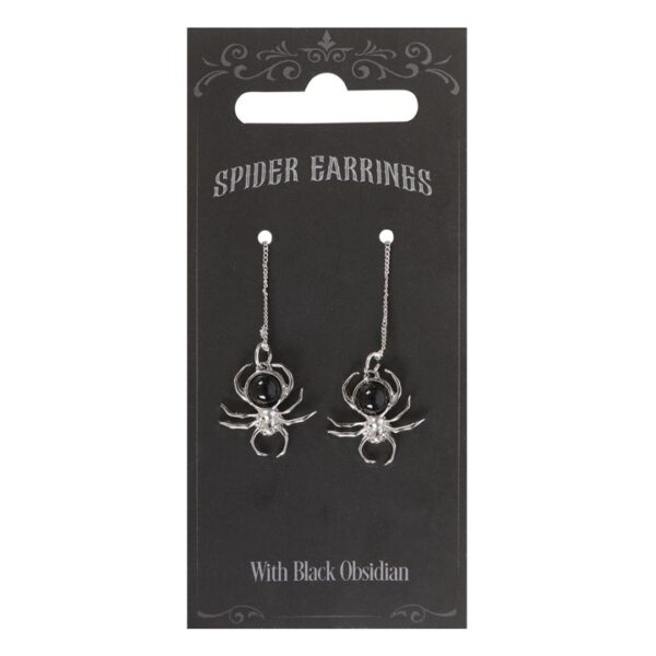 Spider earrings featuring silver metal with black obsidian stones, presented on a decorative card.