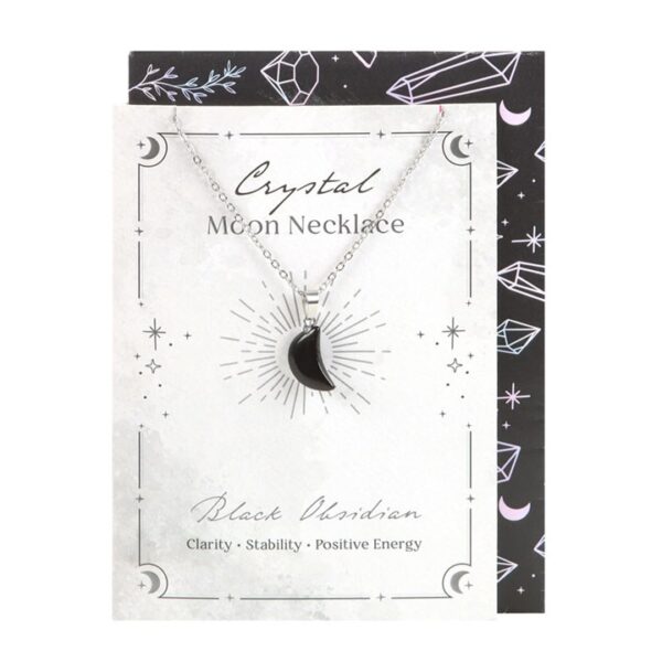 Crystal moon necklace featuring black obsidian, symbolizing clarity, stability, and positive energy on display card.