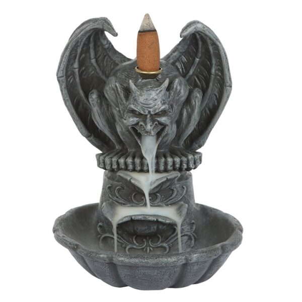 A decorative incense holder featuring a gargoyle design with smoke flowing from its mouth.