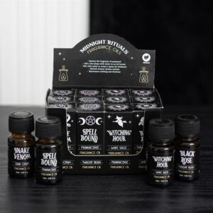 Midnight rituals fragrance oils displayed in a box with various enchanting scent options.