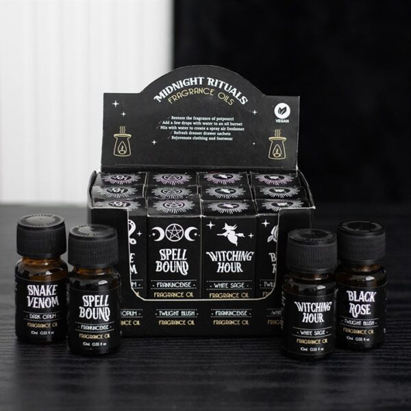 Midnight rituals fragrance oils displayed in a box with various enchanting scent options.